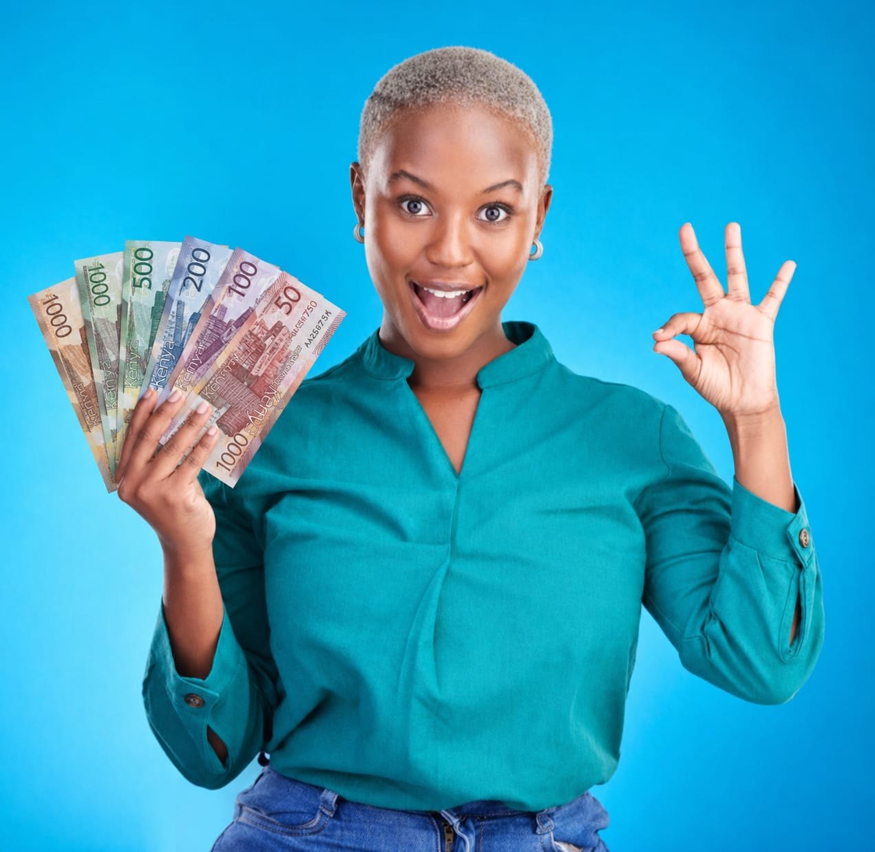 A happy Kenya Skys Credit client celebrating her loan disbursement